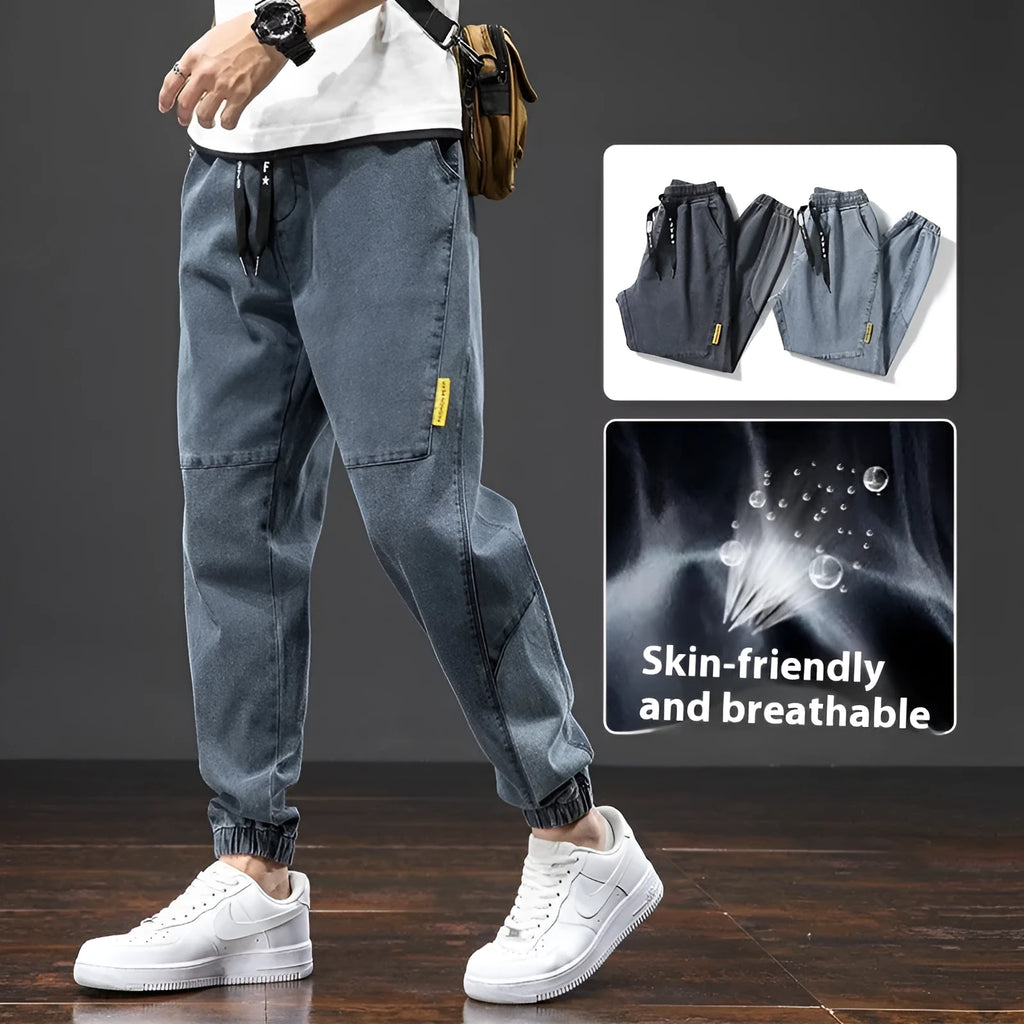 Men's loose fit straight leg cargo jeans in cotton with micro elasticity, shown in blue.