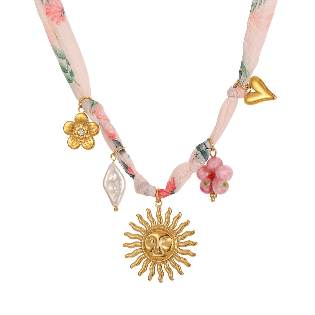 Stainless steel women's necklace with a sun pendant on a regular chain, showing heart and ribbon sun design options.