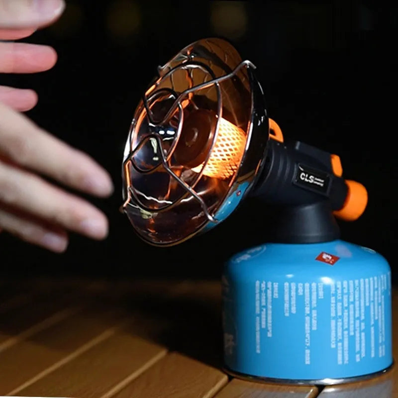 Portable outdoor heating stove with black and orange finish and automatic press ignition
