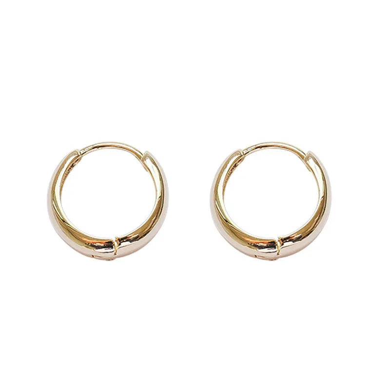 Women's geometric water drop earrings in gold and silver finishes showing three size variations