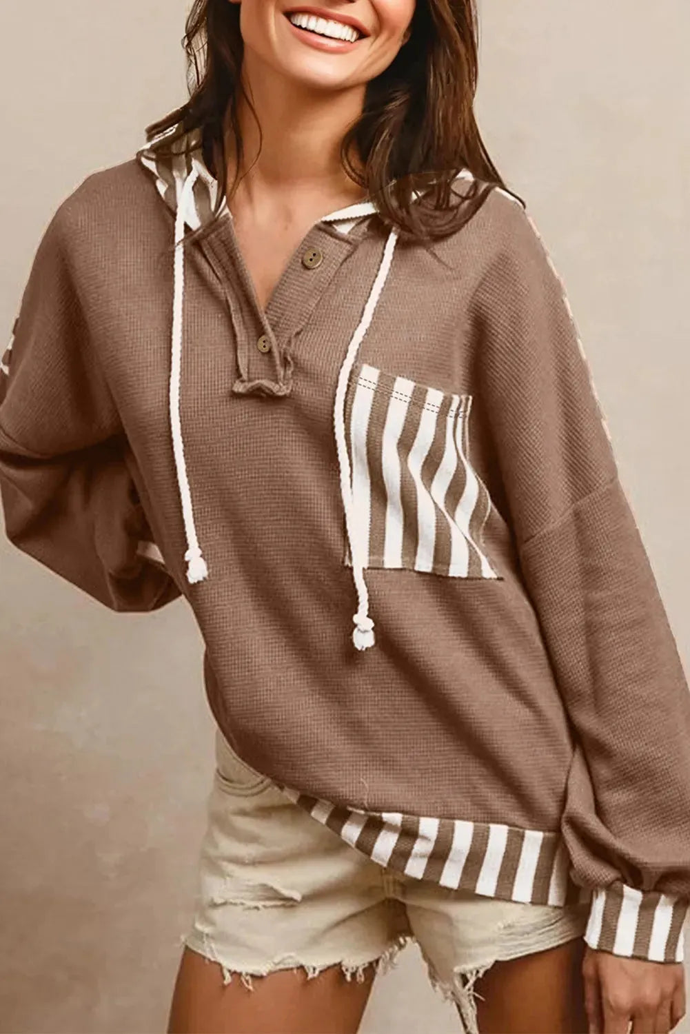 Straw yellow waffle texture hoodie with striped patchwork, button neck, and drawstring hood.
