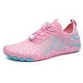 Men's white Upstream lace-up casual sports shoes with a rubber sole on a plain background.