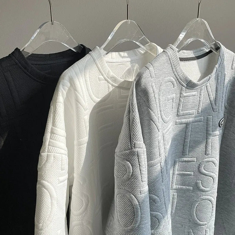 A grey men's loose-fit T-shirt with a retro style and raised 3D letter print on the chest.
