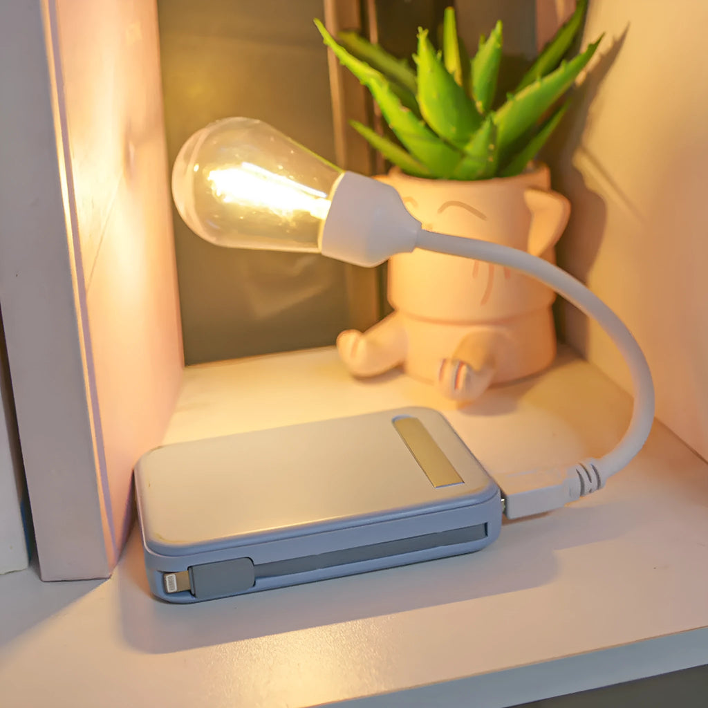 A folding USB rechargeable night light with a warm white tungsten filament S14 bulb visible.