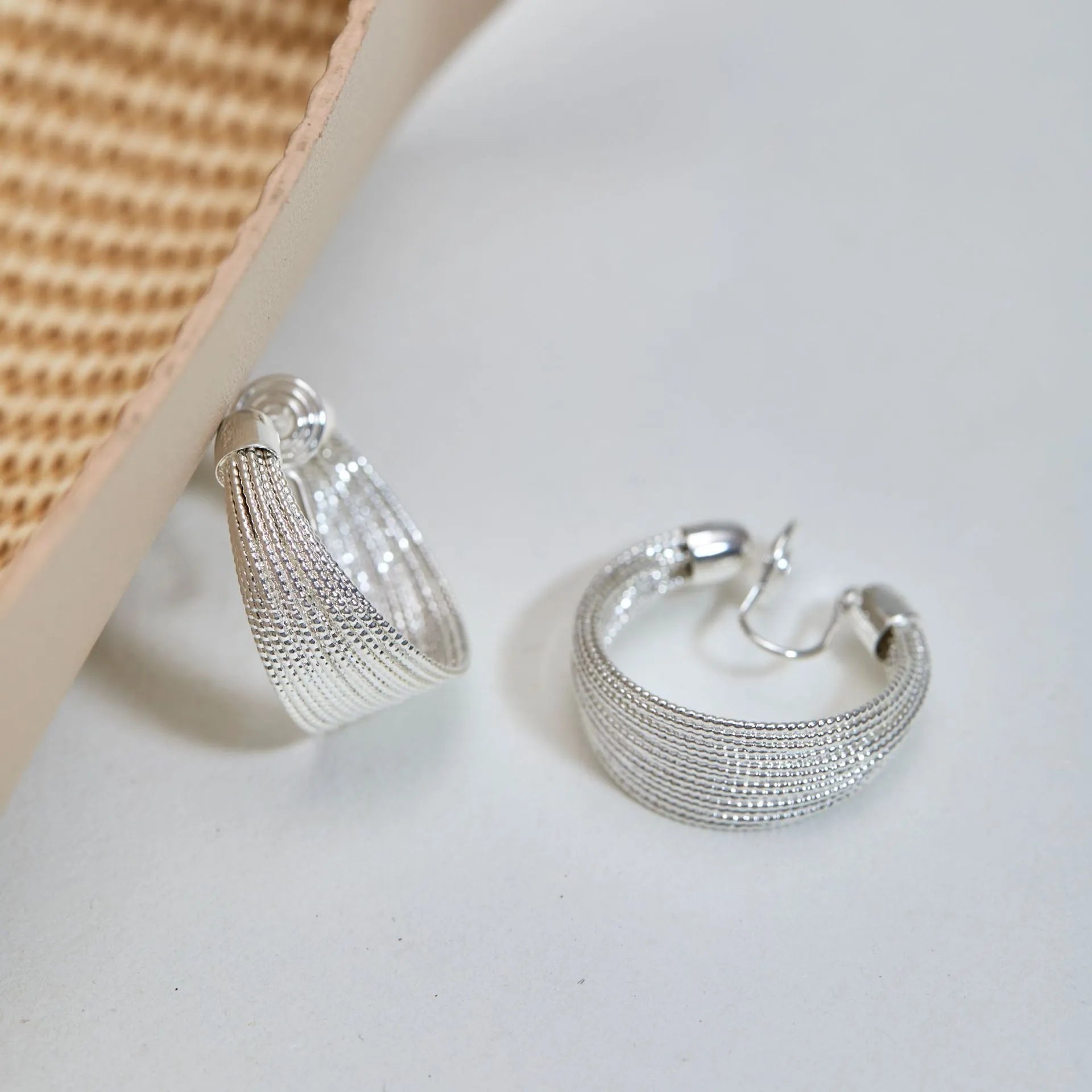 Multi-layer geometric earrings in gold and silver with stud and clip style options