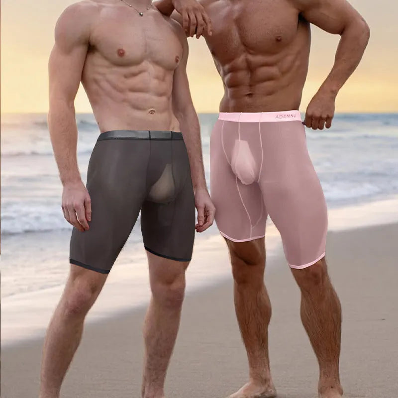 Men's solid colour mesh shorts with seamless knitted nylon fabric in black, white, or pink.