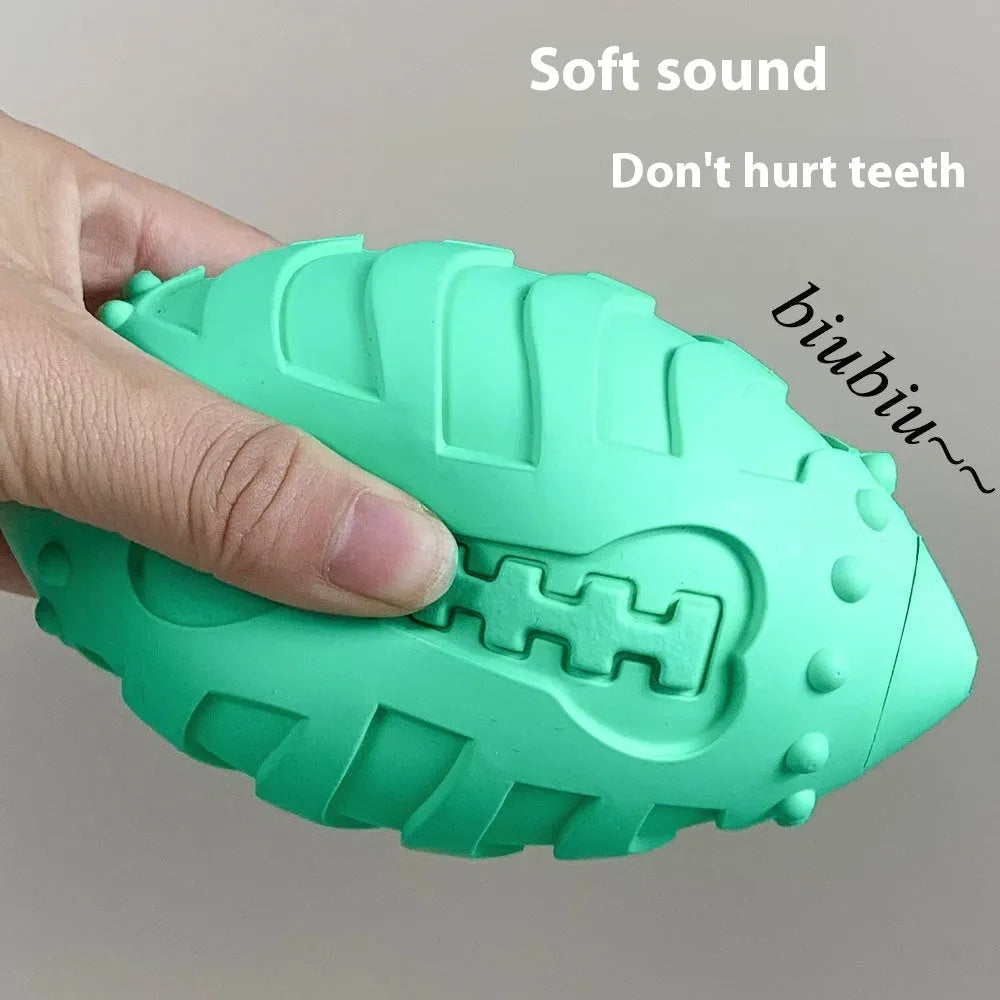 Light green rugby ball shaped dog chew toy with textured rubber surface for interactive play