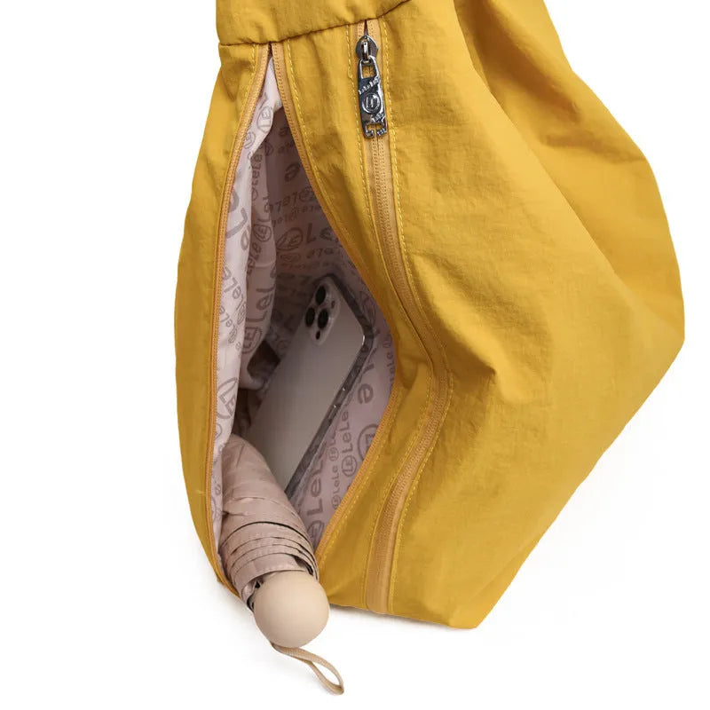 Women's heart-shaped nylon underarm bag in black, blue, khaki, and yellow colour options showing large capacity design