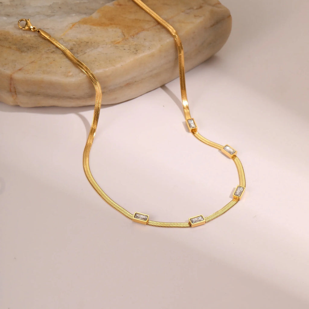 Geometric square zircon pendant necklace on flat snake chain with gold electroplated finish