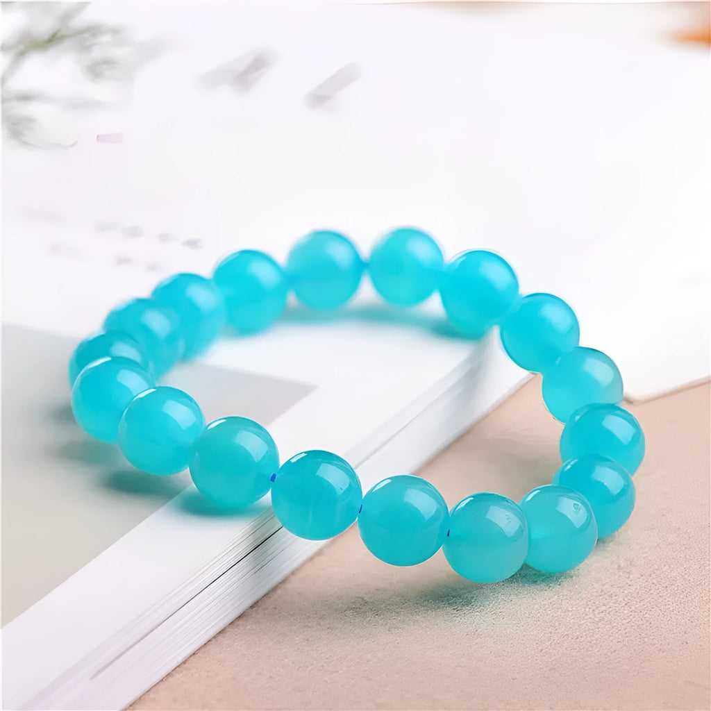 Grade 7A Amazonite natural scattered beads in ice colour showing polished surface and size variations