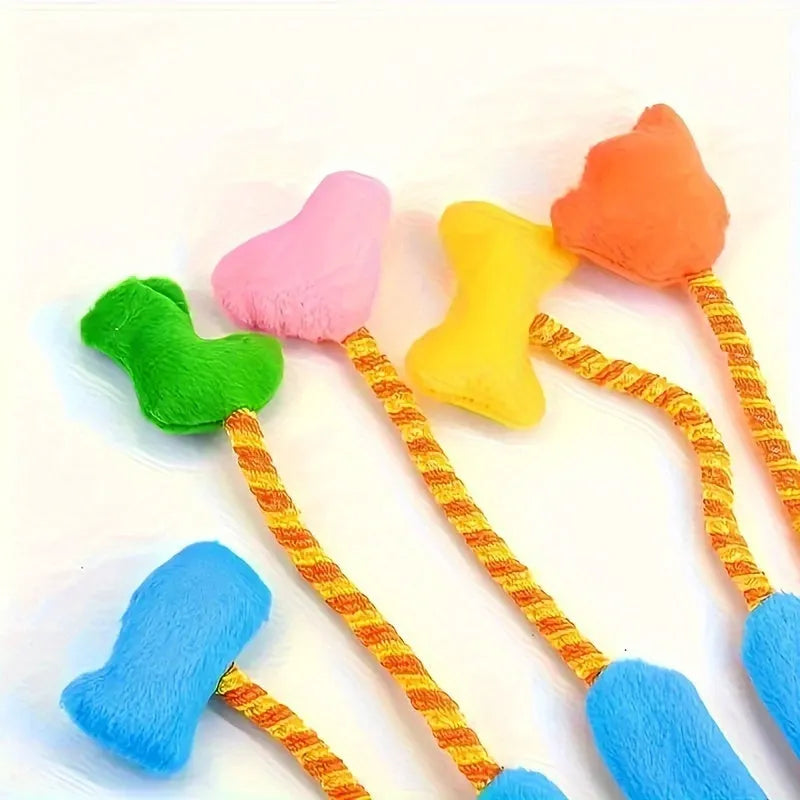 Yellow and blue plush Magic Glove cat toy with trailing tail and integrated bell