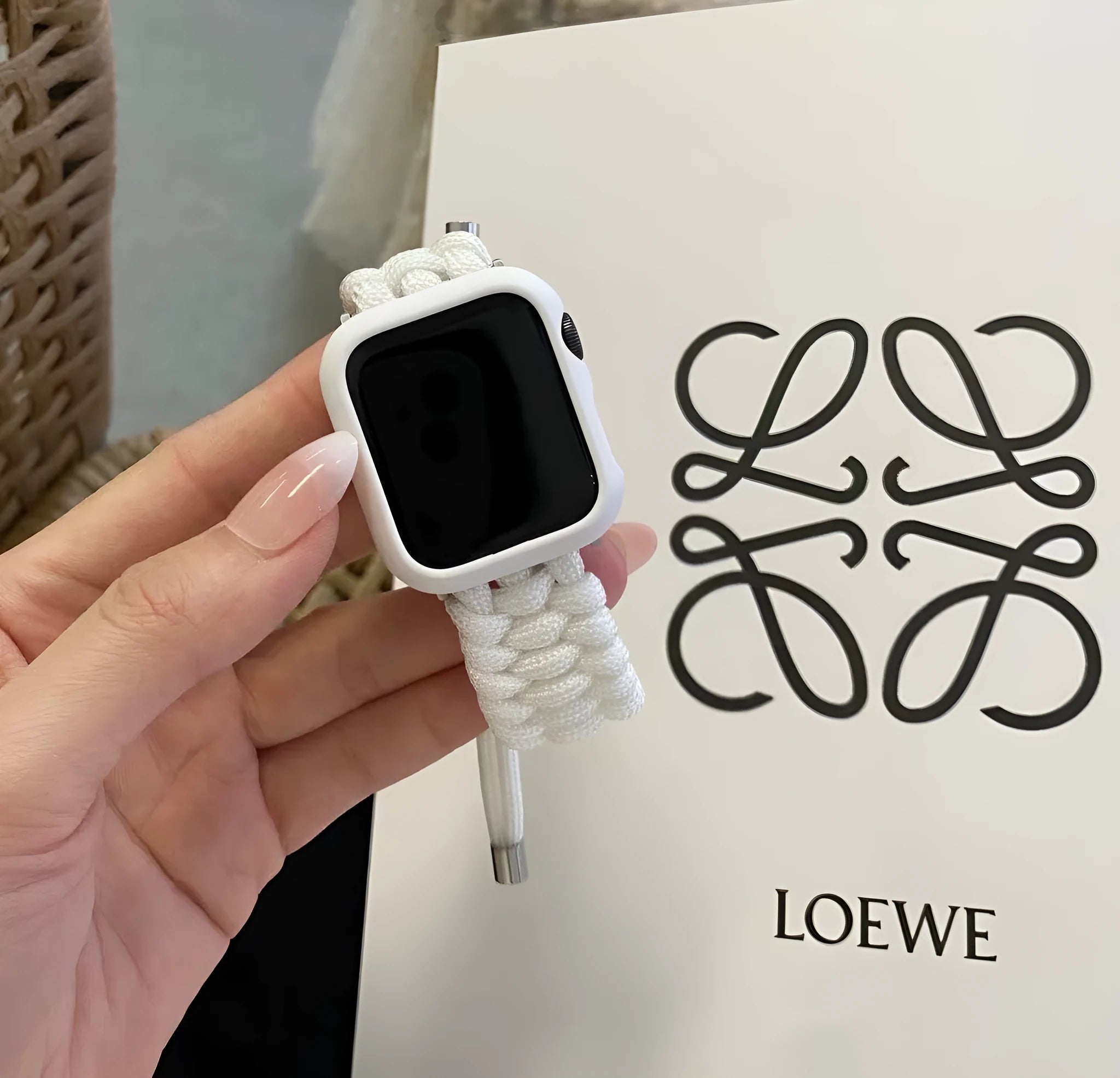Black paracord braided smart watch strap with common raw ear lugs for Apple and Samsung watches.