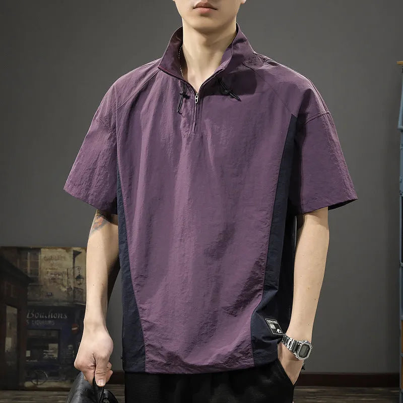 Brown men's loose fit short sleeve shirt with a half-zip stand collar, shown flat.