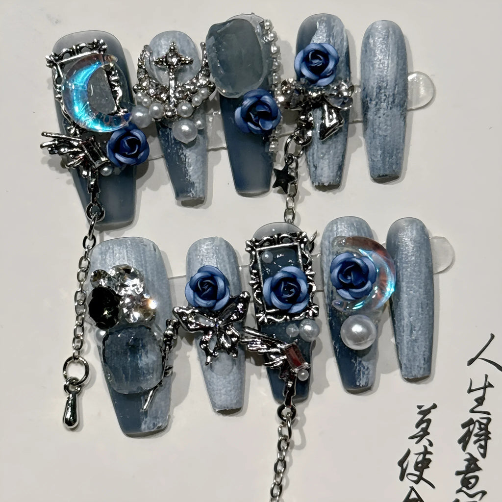 Heavy industry night blue false nails with ornate twinkling rose and tulip flower pattern.
