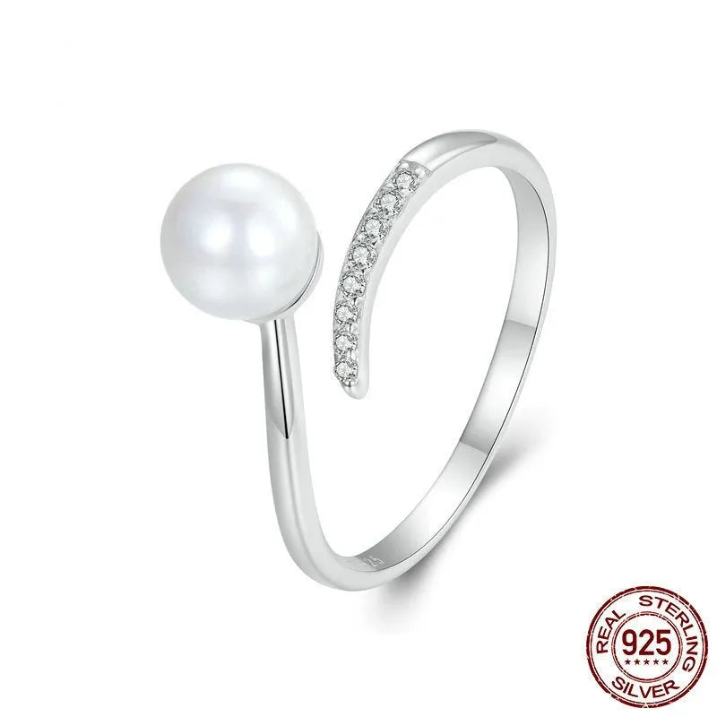 Adjustable S925 sterling silver ring with shell pearls in open loop design