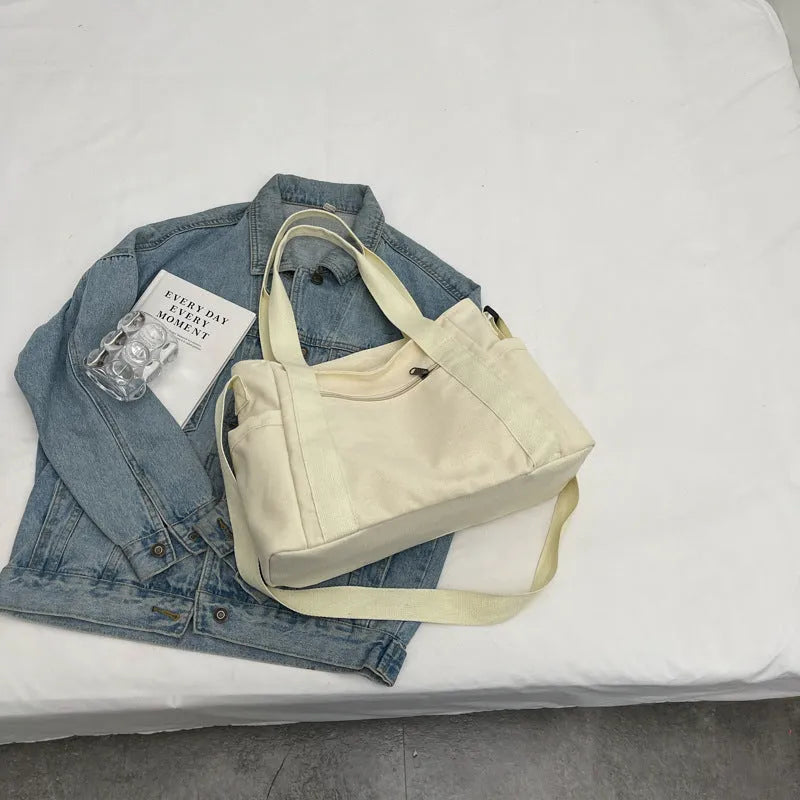 Large capacity polyester shoulder bag for women in four colours with mobile phone compartment