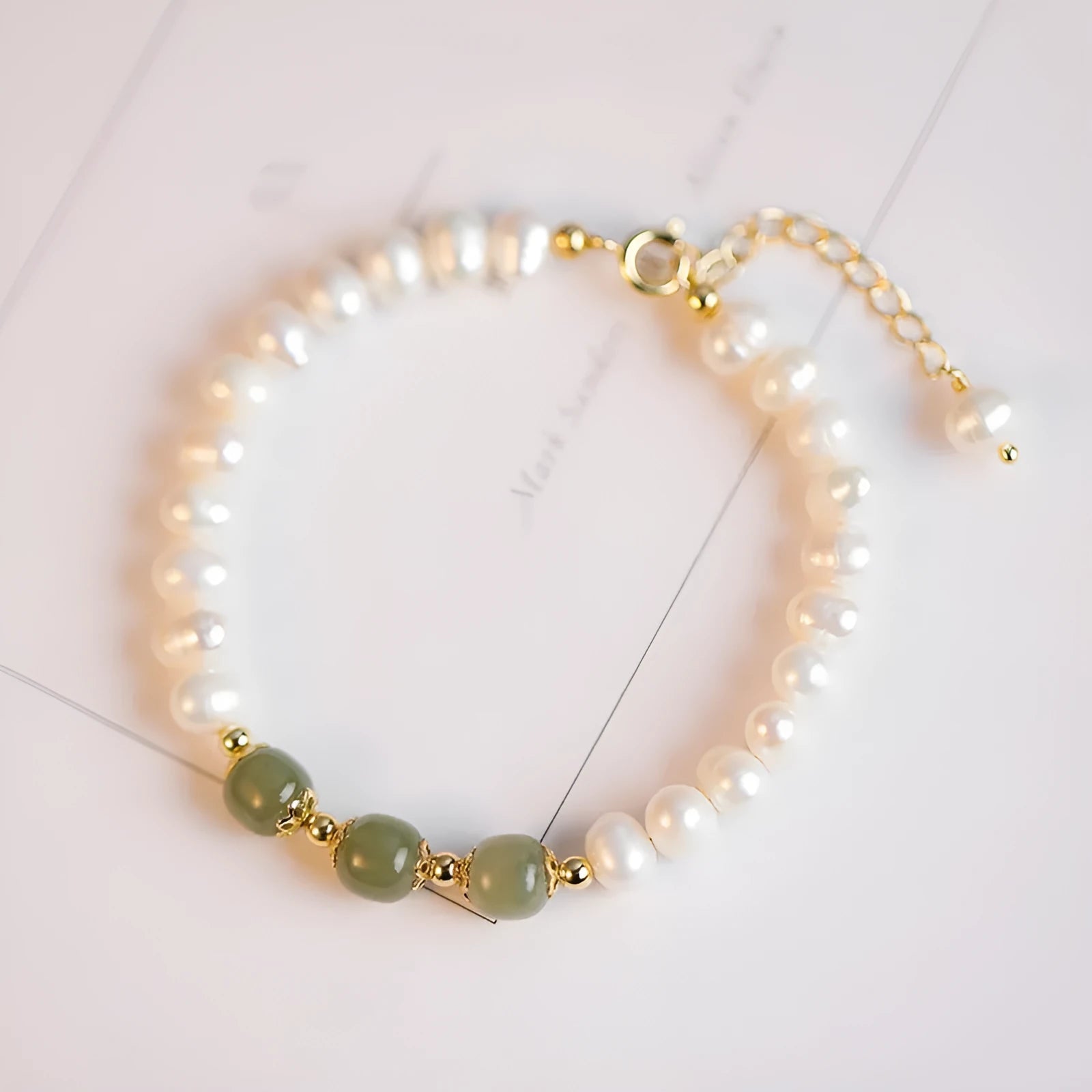 Natural freshwater pearl bracelet with diamond-shaped pearls in a Korean style, shown in deep Hetian jade colour.