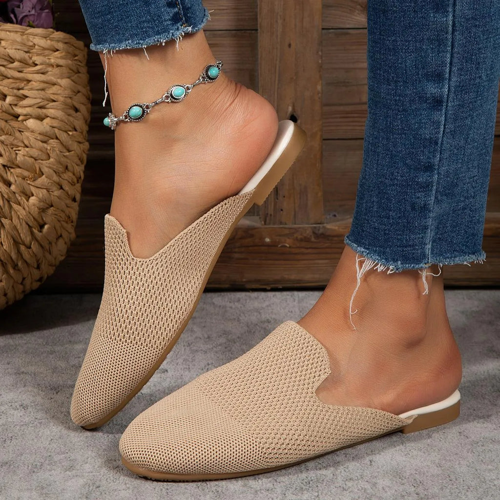 Women's apricot mesh slip-on sandals with round toe and flat rubber sole on a plain background.