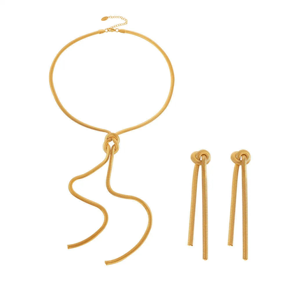 Gold knotted tassel pendant on titanium steel snake chain necklace with matching electroplated earrings
