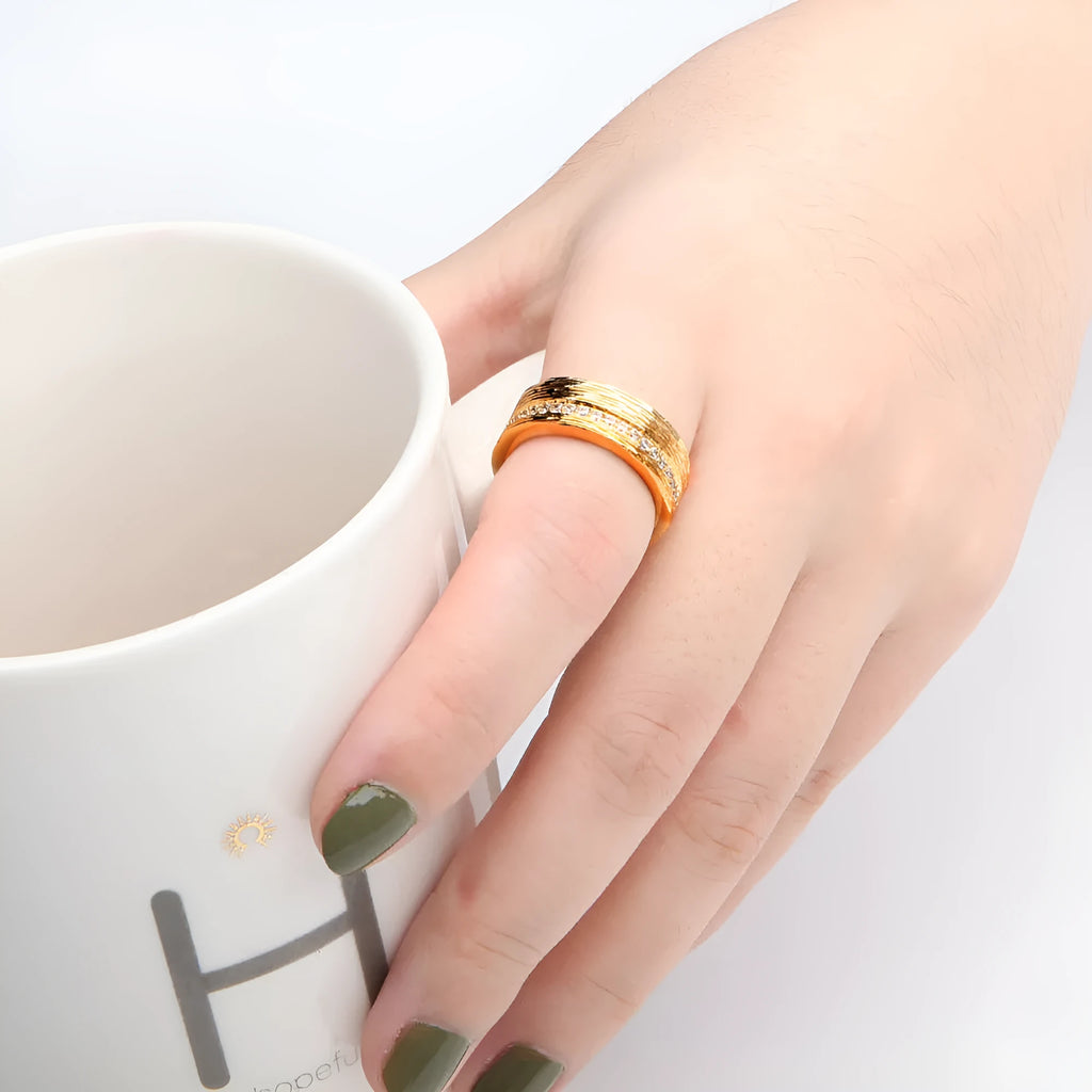 Gold geometric women's zircon ring showing angular design on copper base with electroplated finish