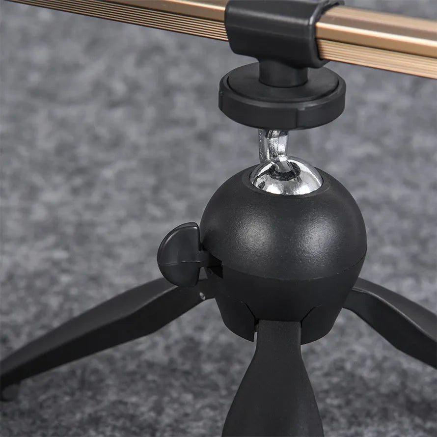 Aluminium ice fishing triangle rod holder bracket on a frozen lake.