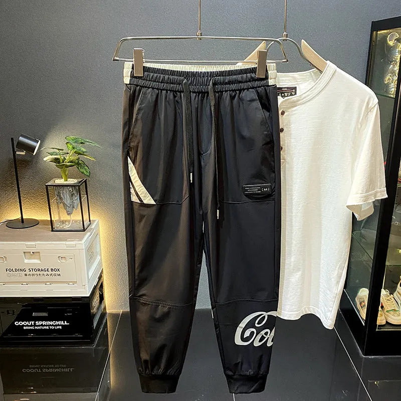 Black men's cropped casual trousers with ankle banding made from ultra-thin ice silk cotton fabric.