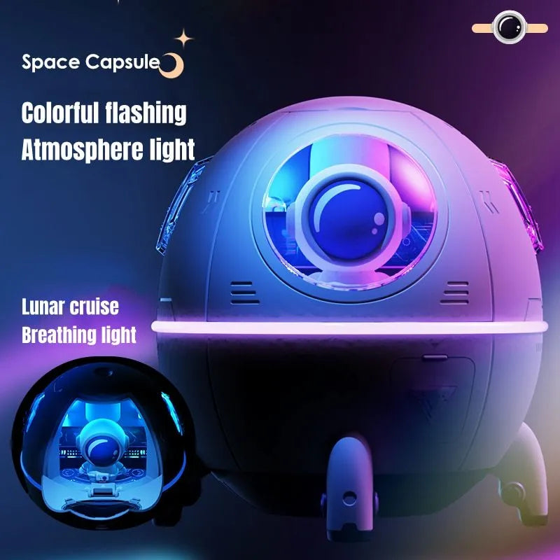 Purple astronaut-shaped USB desktop humidifier with colourful LED light on wooden desk