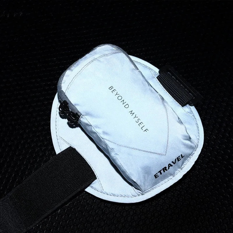 Black reflective running arm bag with adjustable strap and 7-inch capacity.