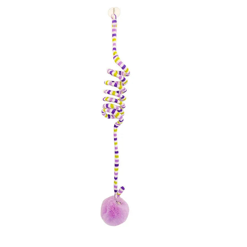 Hanging cat toy with coloured bell stick and inflatable ball attached by suction cup to a door