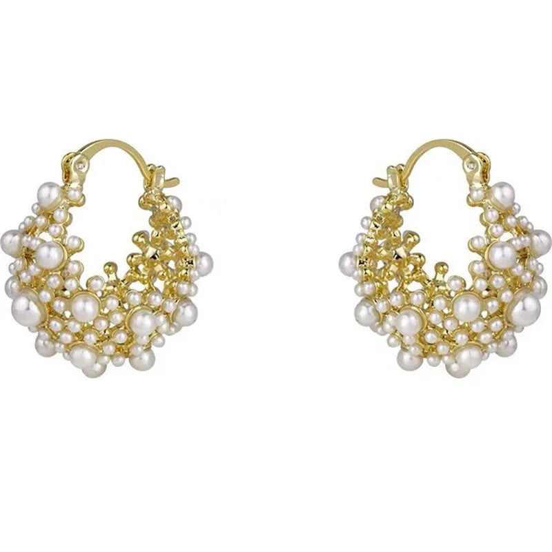 Gold-coloured copper basket flower earrings with pearl inlay and small rice-shaped bead detailing