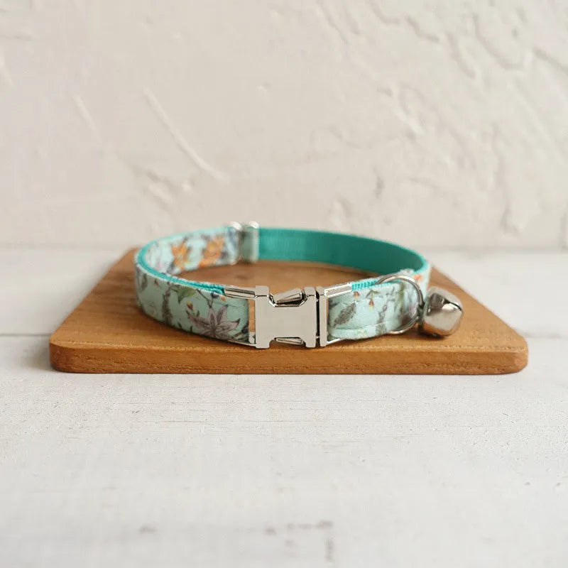 Green adjustable pet collar made from cloth and webbing, available in sizes L and S