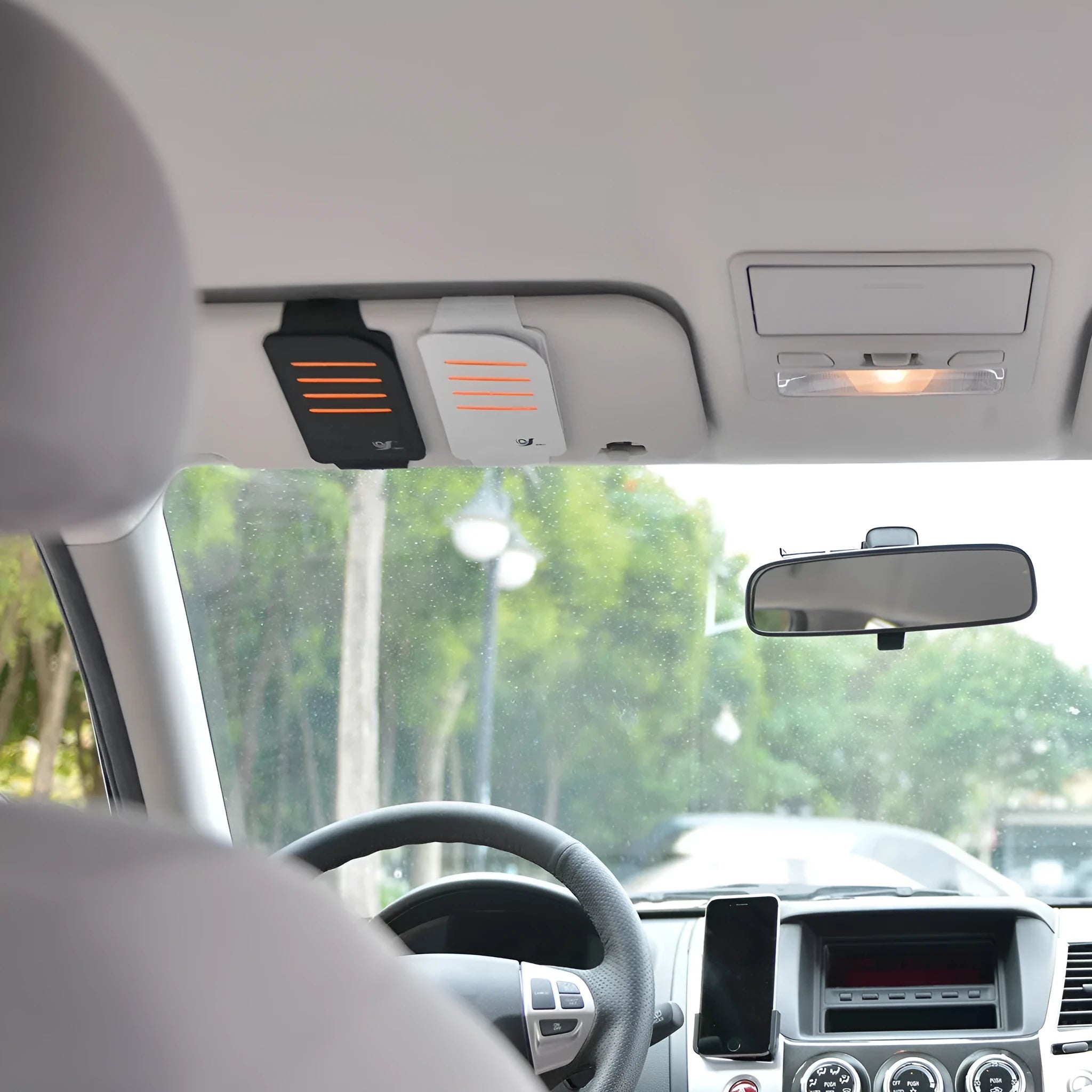 Set of four flexible car sun visor panels and a storage pouch for sun protection.
