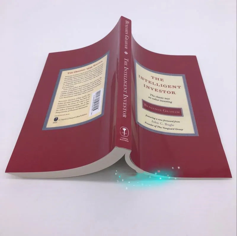 Paperback cover of The Intelligent Investor book by Benjamin Graham with Jason Zweig commentary