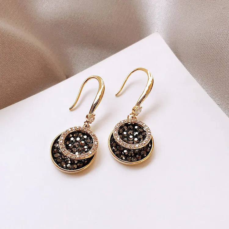 Black retro Hong Kong style alloy earrings with circular geometric design measuring 3.6cm length