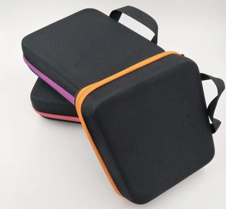 Red EVA essential oil storage bag with 30 compartments for 15ml bottles, shown wall-mounted.
