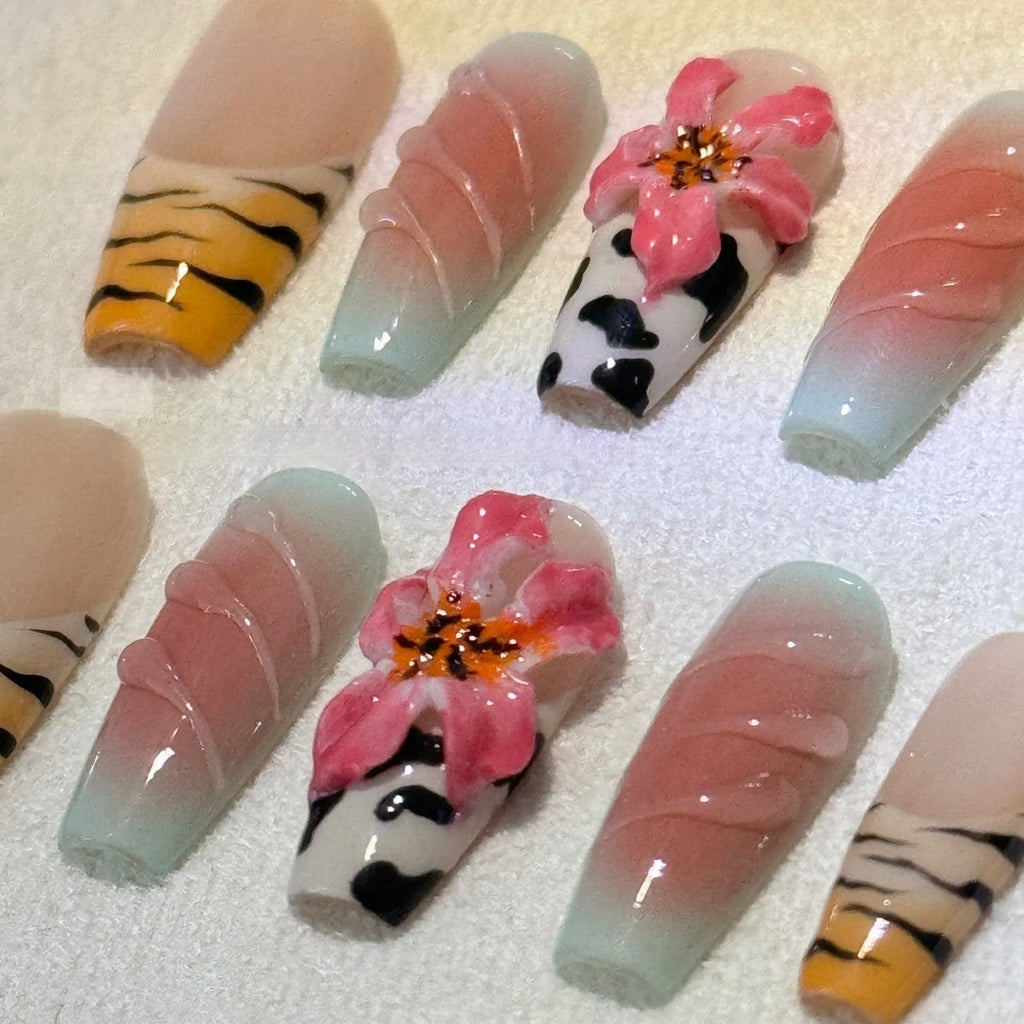 Zebra pattern lily hand carving nail art set with embossed flower and leopard print designs.
