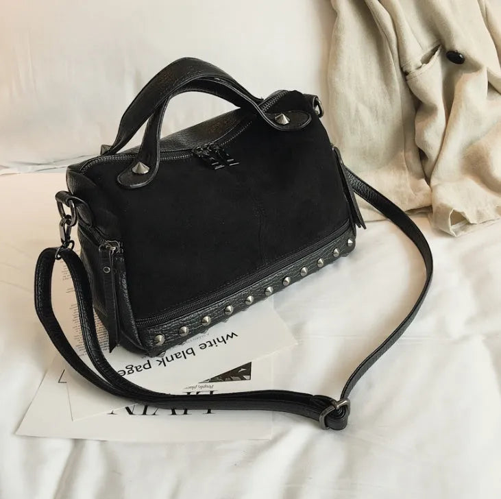 Soft PU leather women's tote shoulder bag in black, shown with smooth zipper and large main compartment.