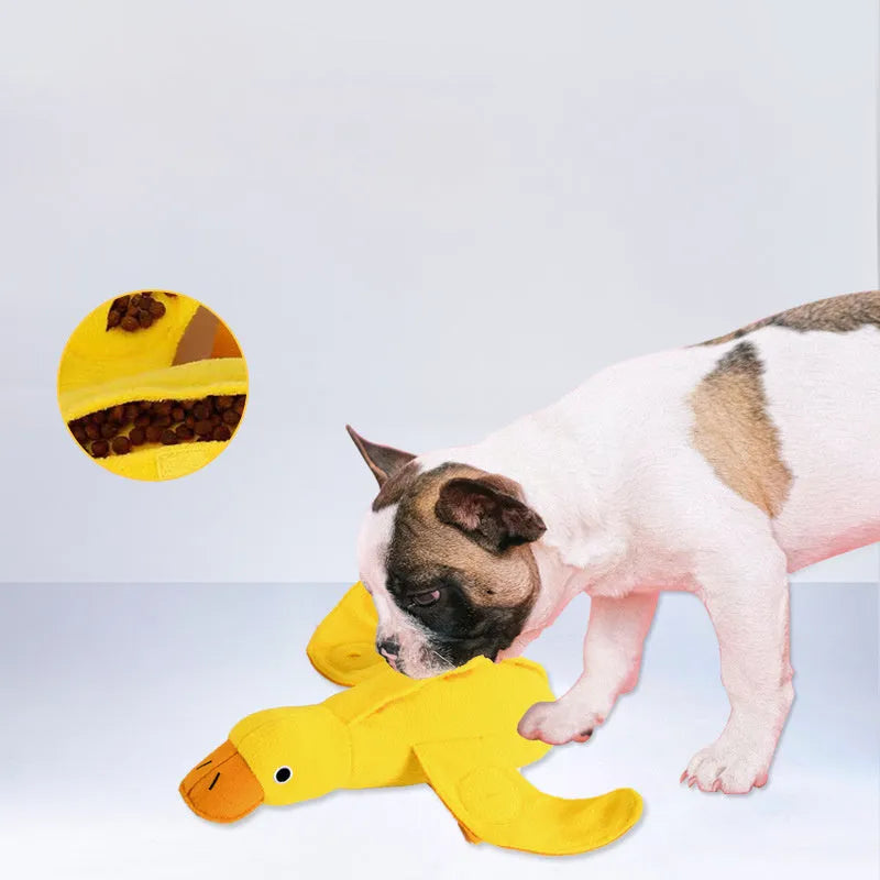 Yellow duck plush dog toy with a barking sound module for treat-dispensing play