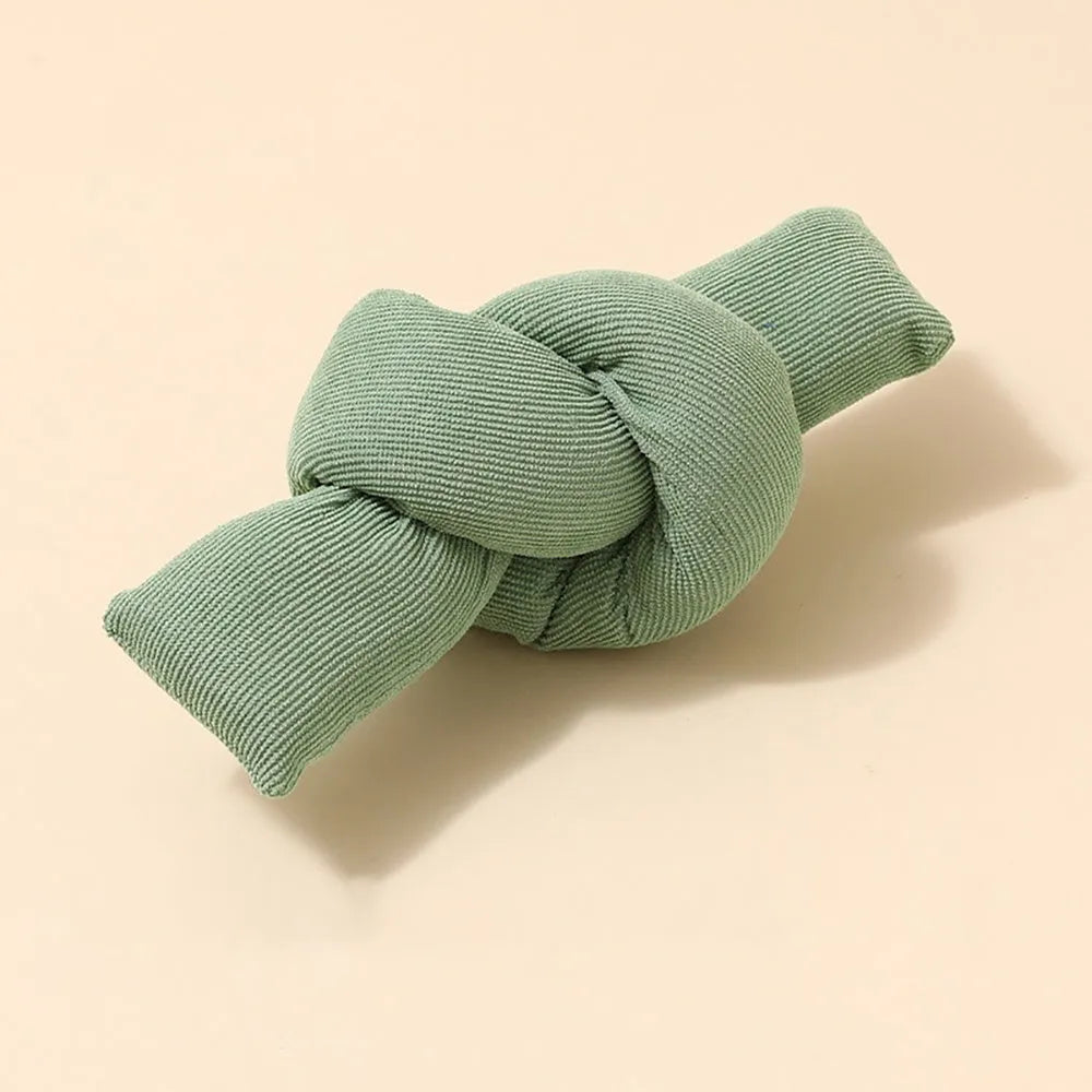 White knotted cotton rope dog toy for chewing and tug of war play.