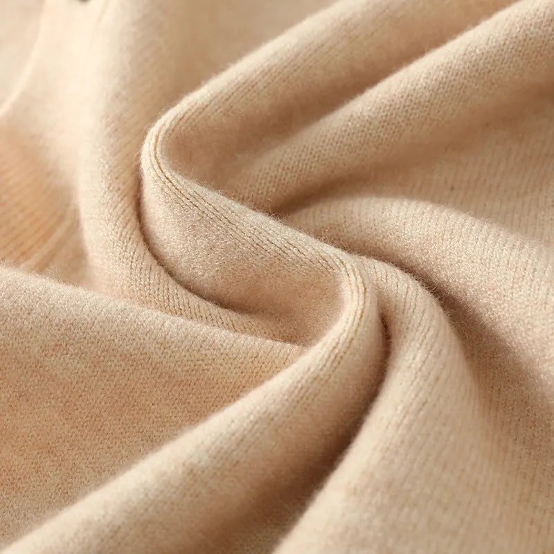 Man wearing a beige Andy velvet V-neck cardigan coat with long sleeves