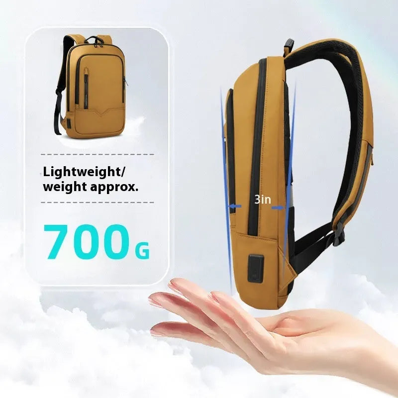 Lightweight grey polyester computer backpack with USB charging port on the shoulder strap