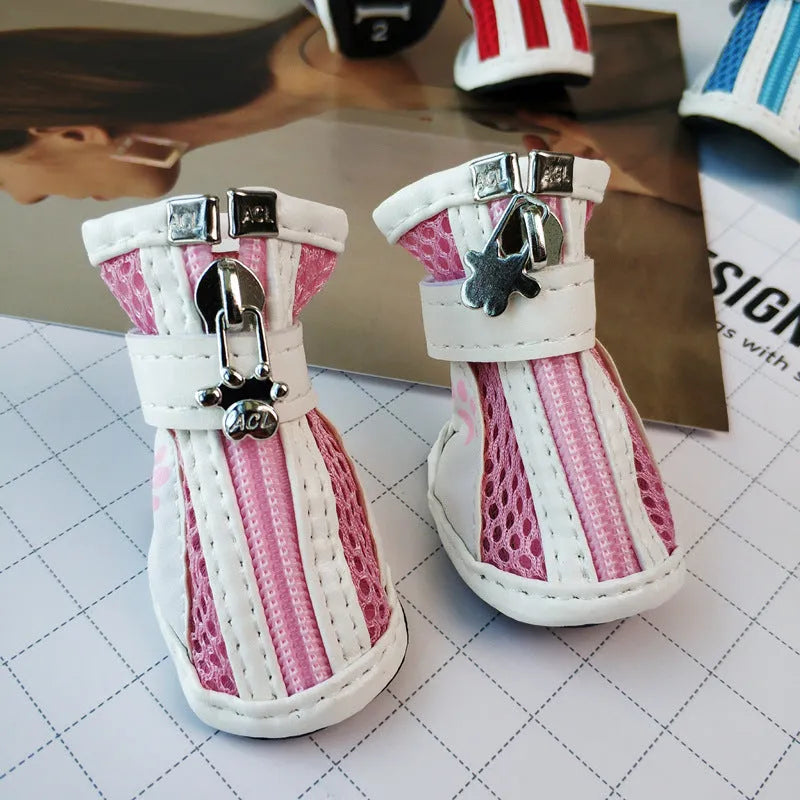 Set of four blue VIP Teddy Schnauzer zipper dog shoes for small dogs on a white background.