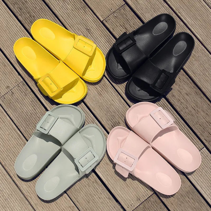 Women's grey blue flip-flop slippers with a buckle fastening on a white background