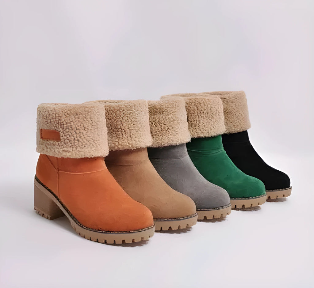 Women's mid-calf suede snow boot with thick heel on a waterproof platform.