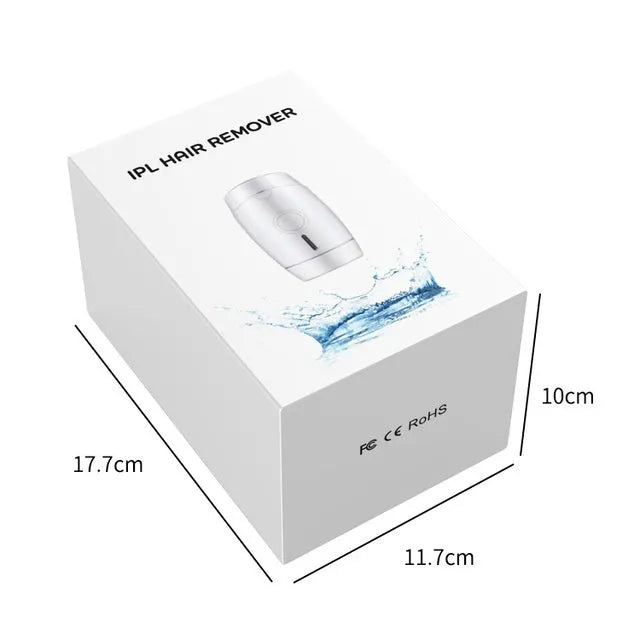 White home laser hair removal instrument with display, shown next to its UK plug and adapter.