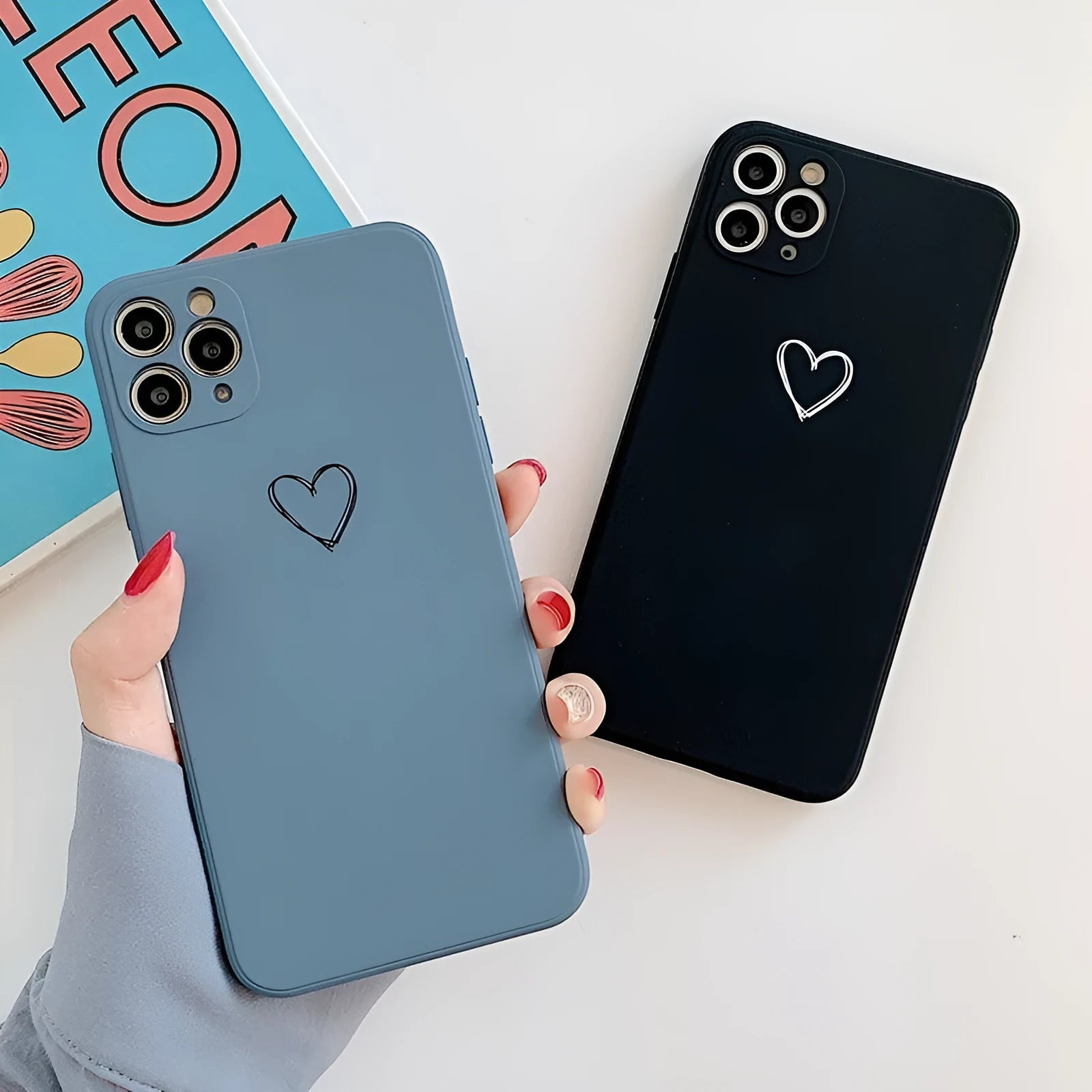 A selection of solid-colour TPU silicone back cover cases for various Apple iPhone models.