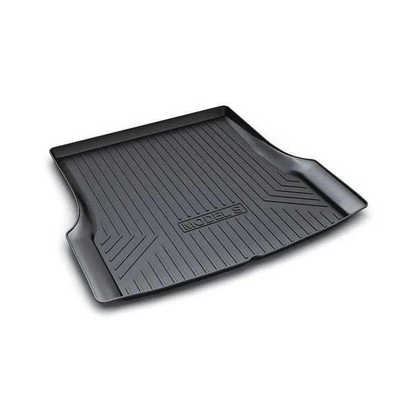 Black rubber floor mat for Tesla car interior with textured TPE footrest section.