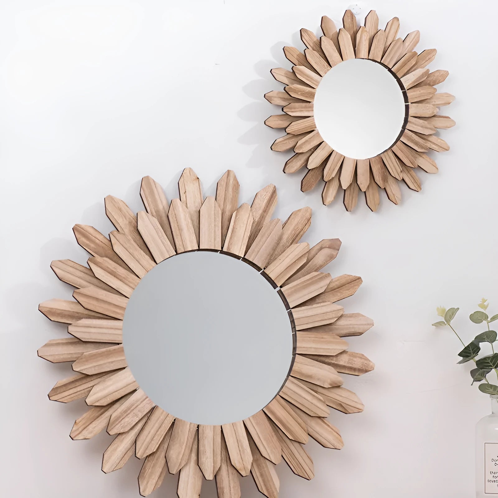 European rustic solid wood circular hanging mirror in baked colour on a wall.