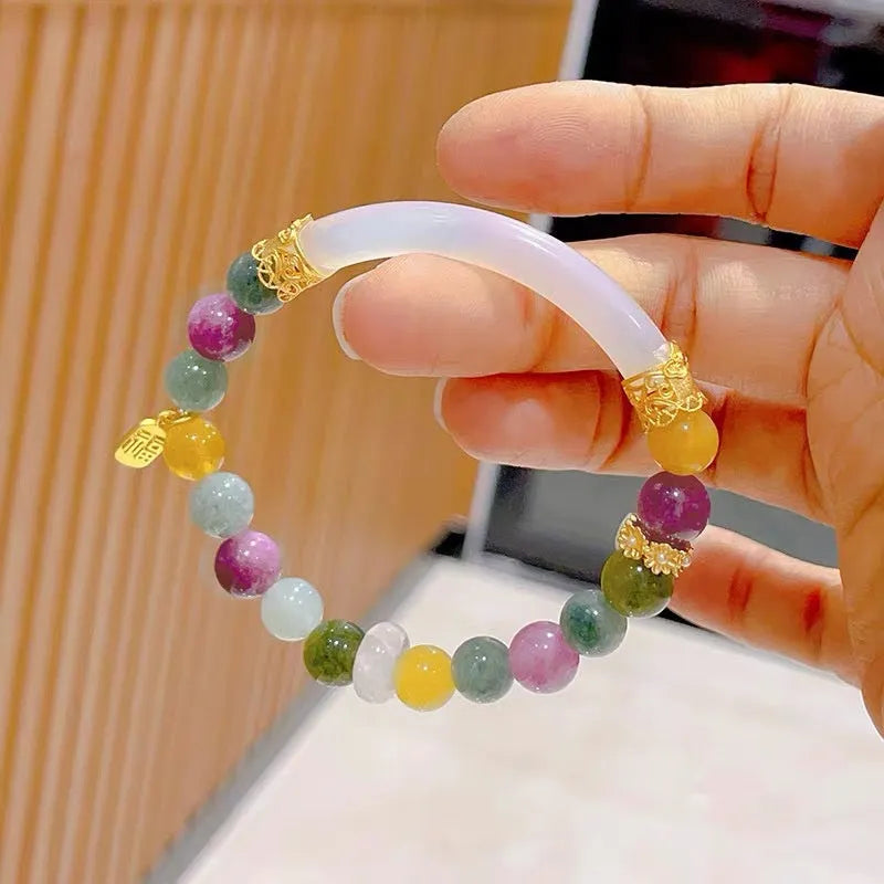 Rainbow tourmaline half-bracelet for women with natural jade colours and electroplated metal setting.