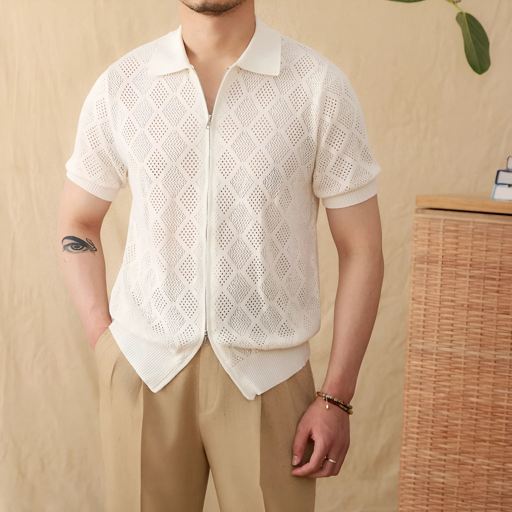 White cotton zip-front cardigan with lapel collar and short sleeves laid flat.